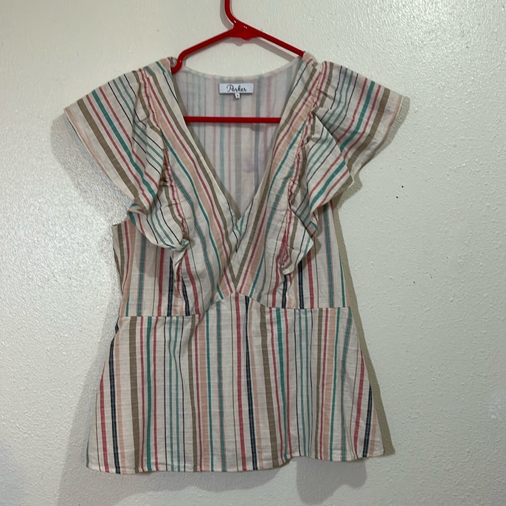 Parker sleeveless blouse of cream with mult-colored stripes. Size Small